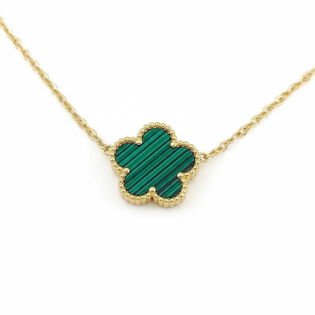 Green malachite clover necklace on white background